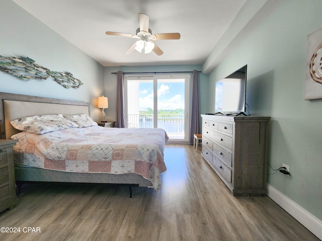 bedroom featuring access to outside, hardwood / wood-style floors, and ceiling fan