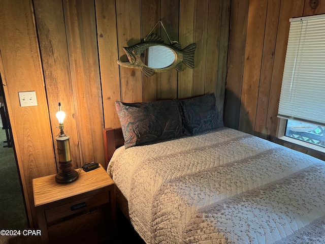 bedroom with wooden walls