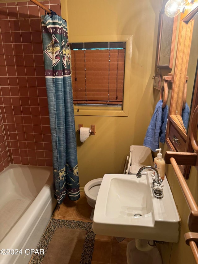 full bathroom with sink, toilet, shower / bathtub combination with curtain, and tile patterned flooring