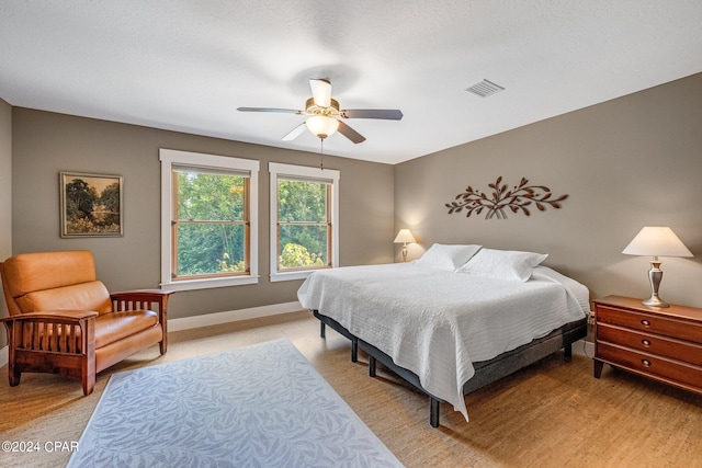 bedroom featuring ceiling fan and light wood-type flooring