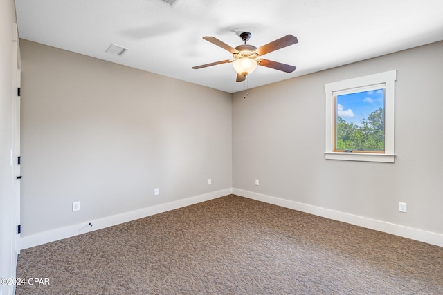 unfurnished room featuring ceiling fan and carpet