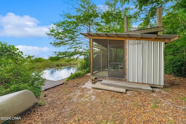 view of outbuilding featuring a water view