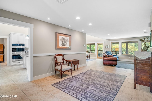 sitting room featuring light tile patterned floors