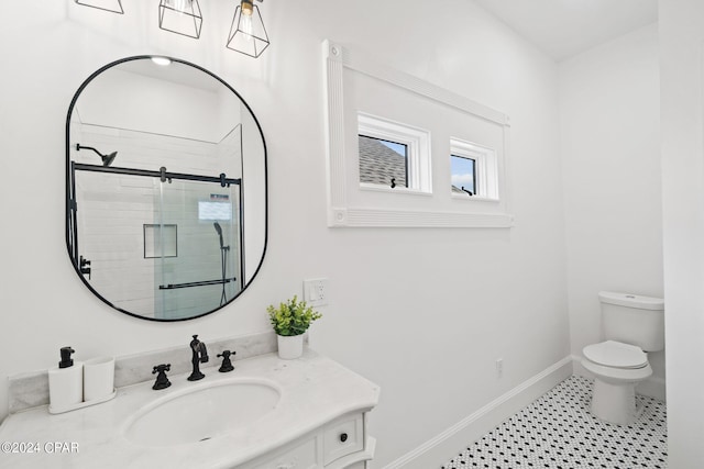 bathroom featuring vanity, toilet, a shower with door, and tile patterned flooring