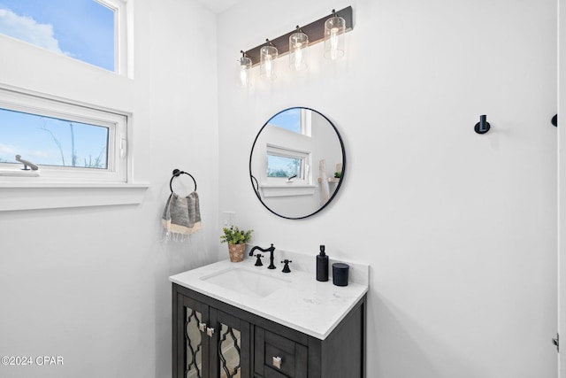 bathroom with vanity and a wealth of natural light