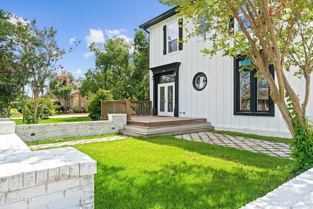 exterior space featuring a wooden deck and french doors