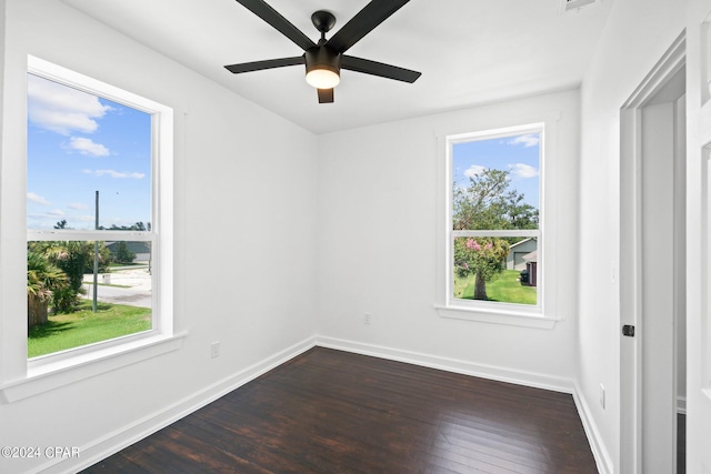 unfurnished room featuring a wealth of natural light, ceiling fan, and hardwood / wood-style floors