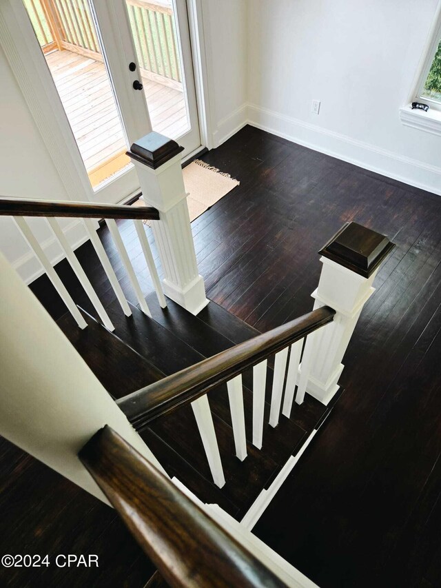 stairway with dark wood-type flooring