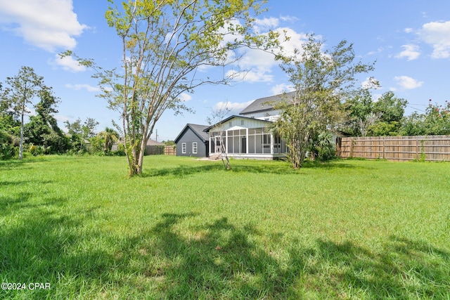 view of yard with a sunroom