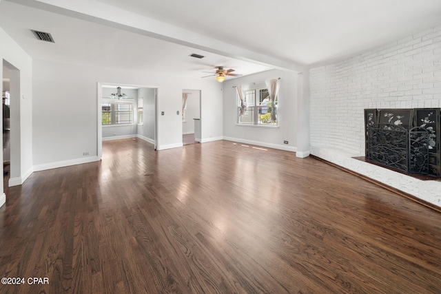 unfurnished living room featuring ceiling fan, a fireplace, and hardwood / wood-style floors