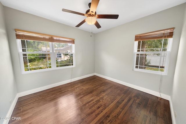 unfurnished room featuring hardwood / wood-style flooring, ceiling fan, and a wealth of natural light