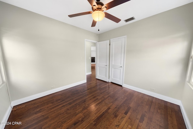 unfurnished bedroom with ceiling fan and wood-type flooring