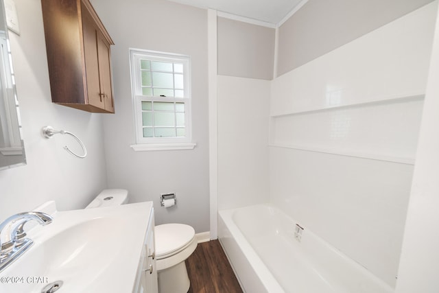 full bathroom featuring toilet, hardwood / wood-style floors, vanity, and shower / washtub combination