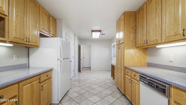 kitchen featuring white appliances and light tile patterned floors