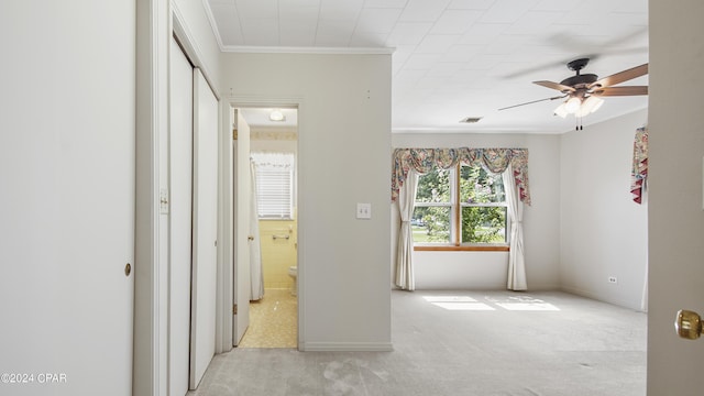 bedroom with ceiling fan, light colored carpet, and ornamental molding