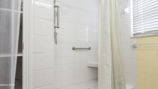 bathroom with a shower with curtain