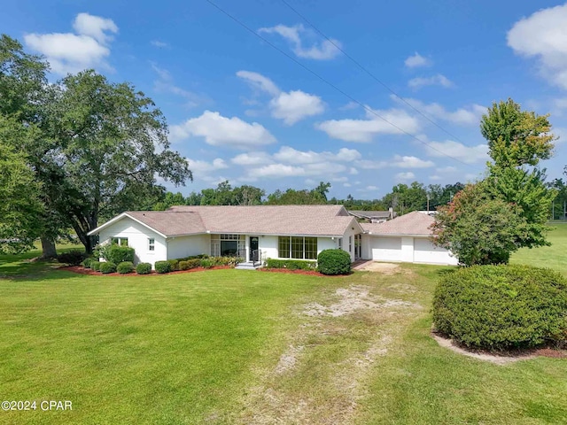 ranch-style home with a front lawn