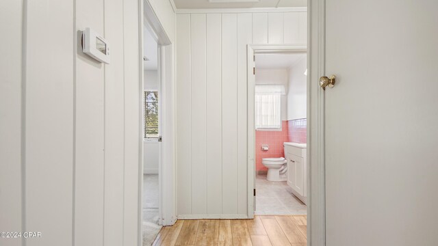 hall with light wood-type flooring