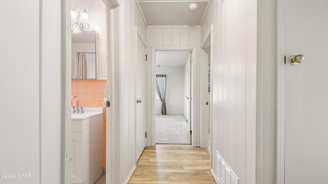 hallway featuring light wood-type flooring