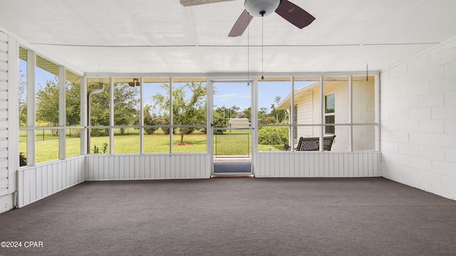 unfurnished sunroom with ceiling fan and plenty of natural light