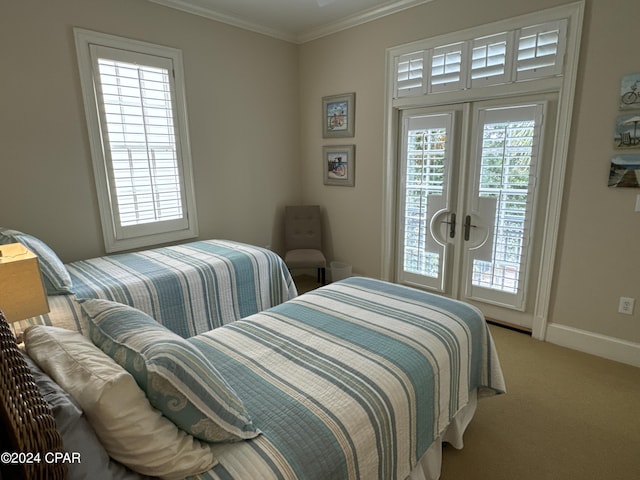 carpeted bedroom featuring ornamental molding and french doors