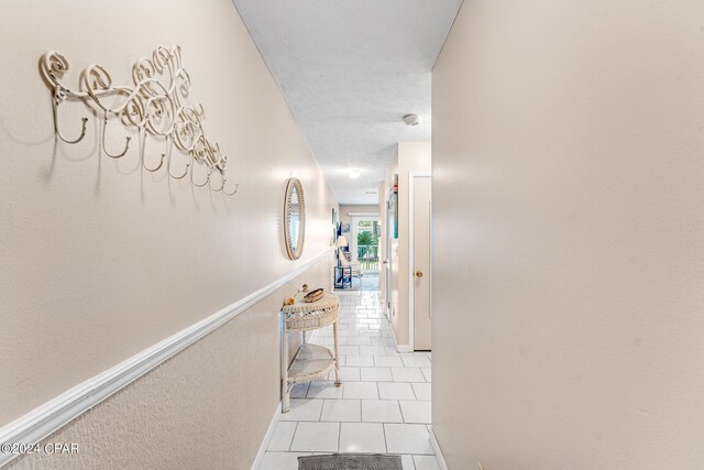 hallway with light tile patterned floors