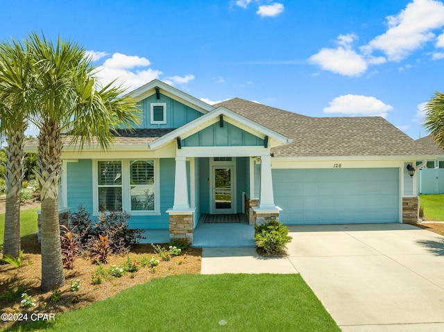 craftsman inspired home with a porch and a garage