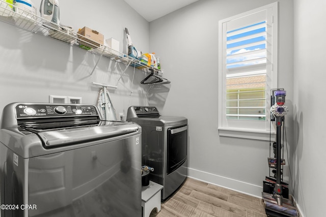 washroom featuring washing machine and dryer