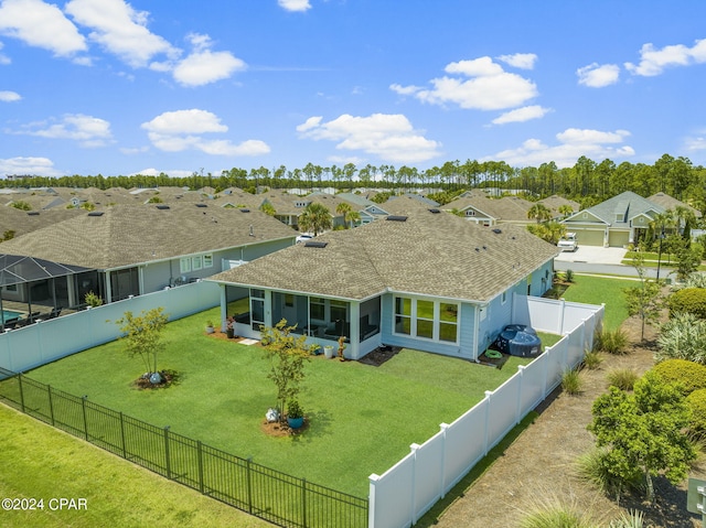 exterior space with a yard and a sunroom