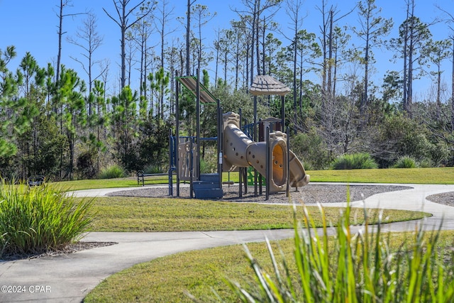 view of play area featuring a lawn