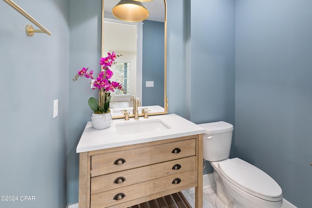 bathroom with vanity and toilet