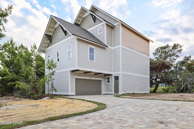 view of property exterior with a garage