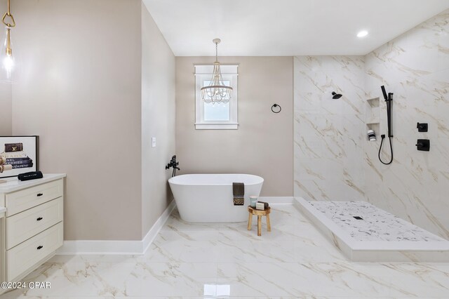 bathroom with separate shower and tub and an inviting chandelier