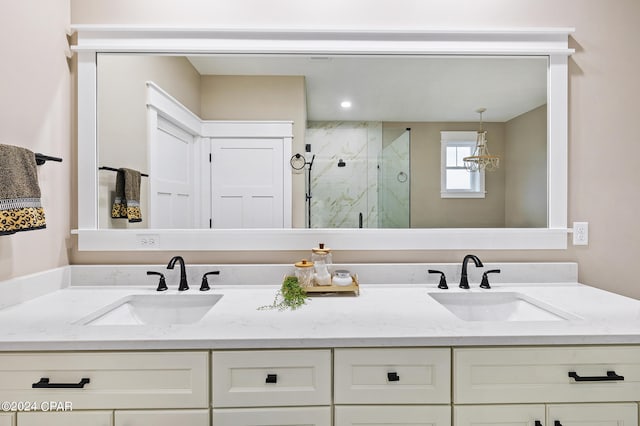 bathroom featuring vanity and an enclosed shower