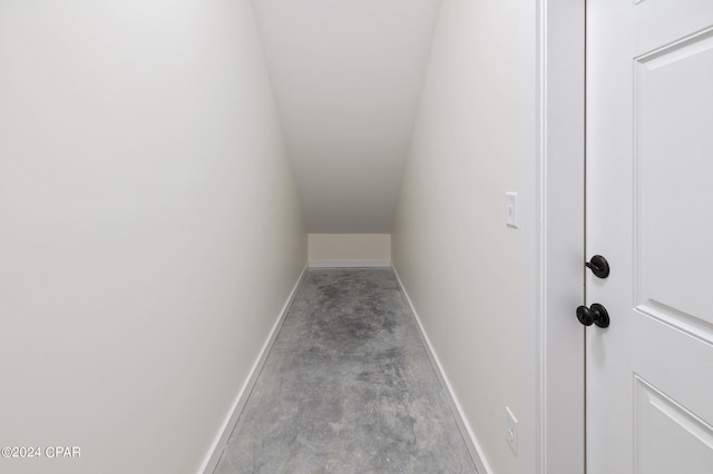 interior space with concrete floors and baseboards