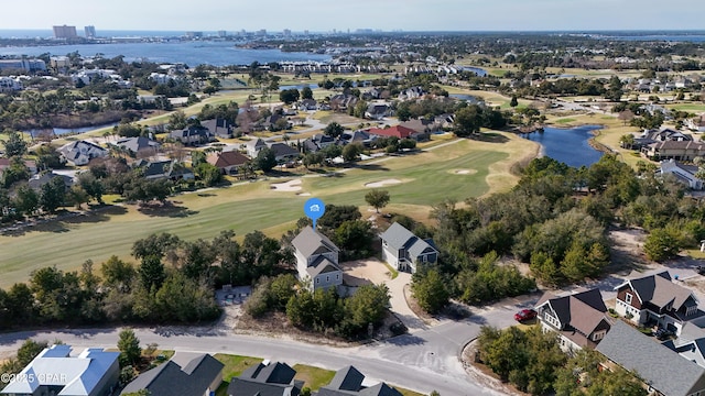 bird's eye view with a water view, a residential view, and golf course view