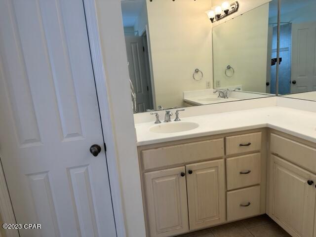 bathroom with vanity and tile patterned flooring