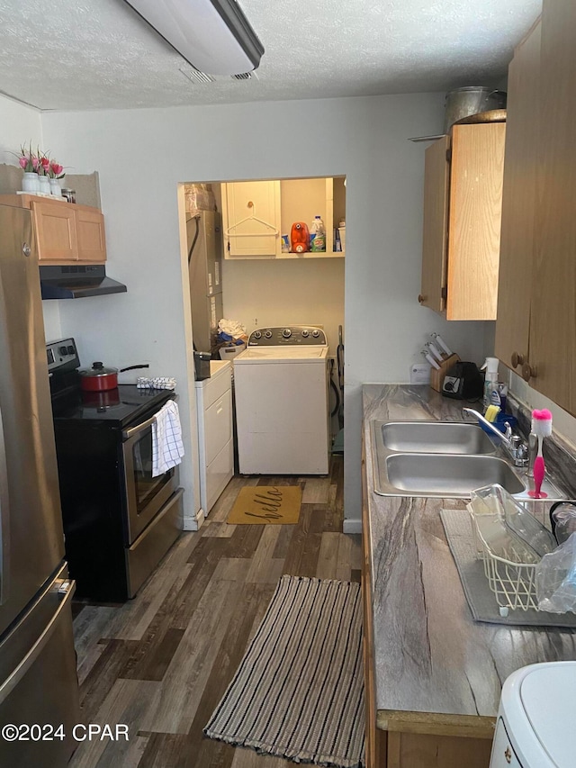 kitchen featuring dark hardwood / wood-style floors, appliances with stainless steel finishes, sink, and a textured ceiling