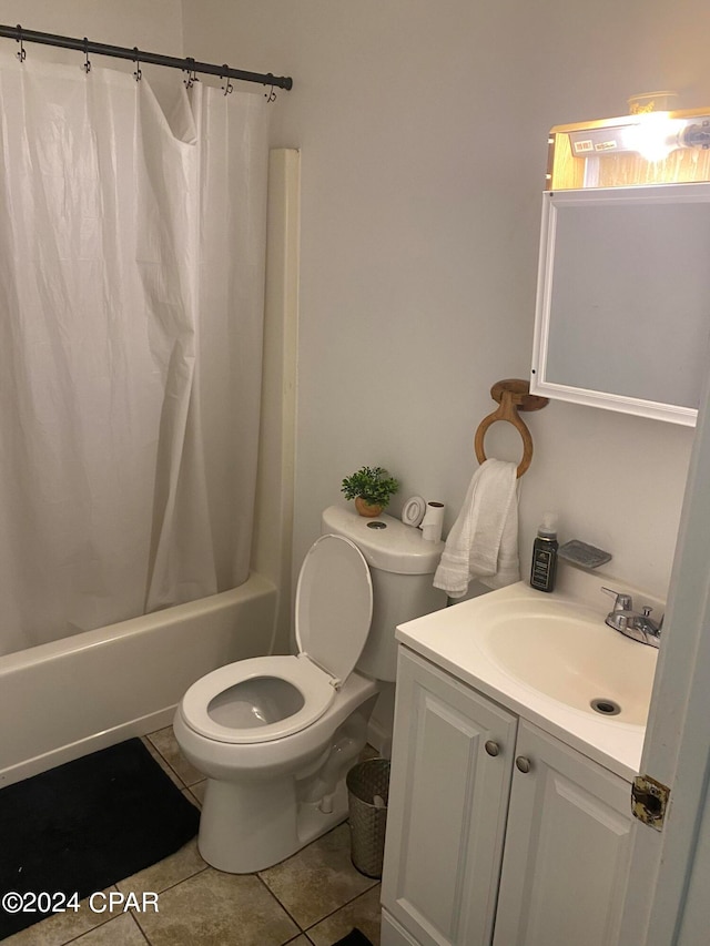 full bathroom featuring vanity, tile patterned flooring, toilet, and shower / tub combo with curtain