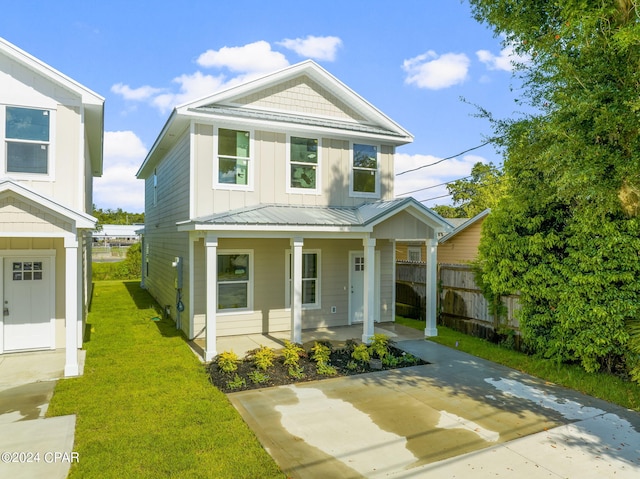 view of front of house with a front lawn and a porch