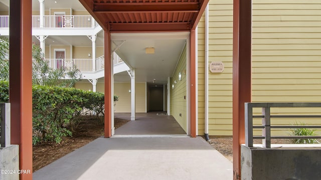 doorway to property featuring a carport