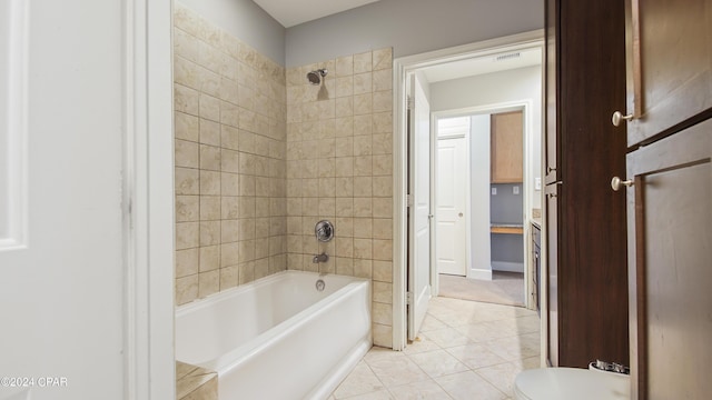 bathroom with tile patterned flooring and tiled shower / bath