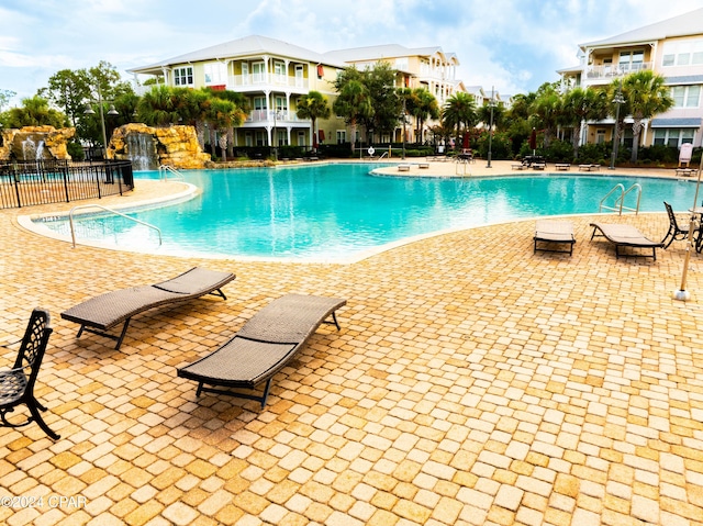 view of pool featuring a patio