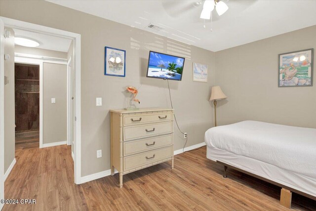 bedroom featuring ceiling fan and light wood-type flooring