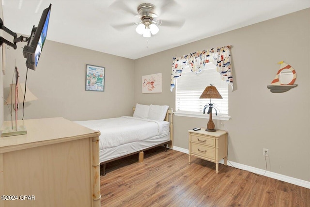 bedroom featuring ceiling fan and light hardwood / wood-style floors