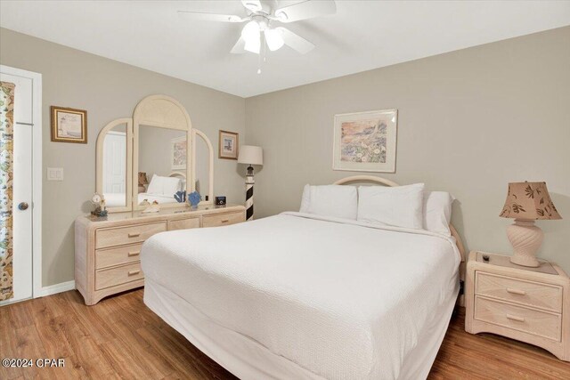 bedroom featuring hardwood / wood-style floors and ceiling fan