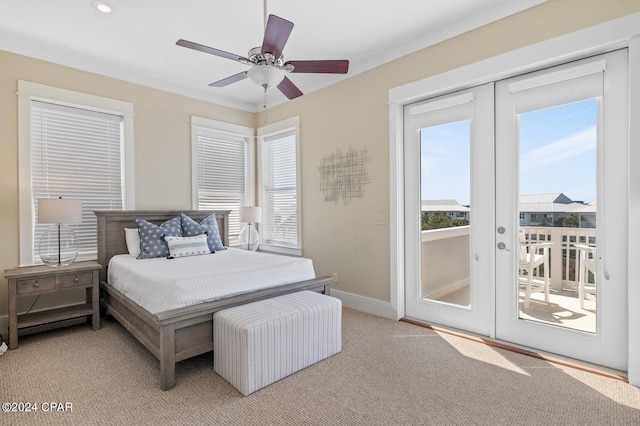 carpeted bedroom with access to exterior, french doors, and ceiling fan