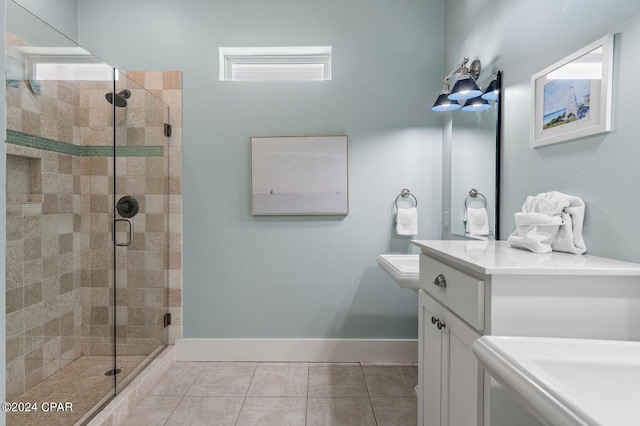 bathroom featuring vanity, tile patterned floors, and walk in shower