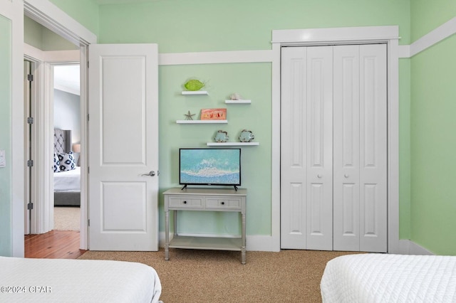 carpeted bedroom with a closet