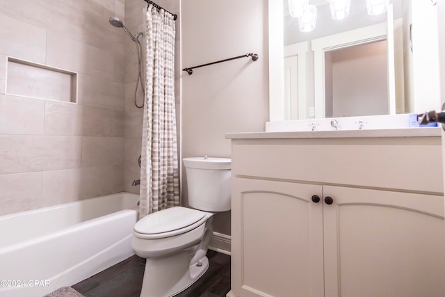 full bathroom with hardwood / wood-style floors, shower / bath combination with curtain, toilet, and vanity